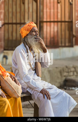 Portrait of a devotee waiting in streets  during Holi Celebrations at Mathura,Uttarpradesh,India,Asia Stock Photo