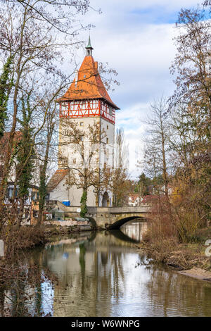 Germany, Waiblingen city gate and bridge reflecting in river rems water Stock Photo