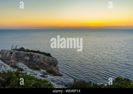 Greece, Zakynthos, perfect romantic orange sunset sky over endless blue ocean horizon Stock Photo