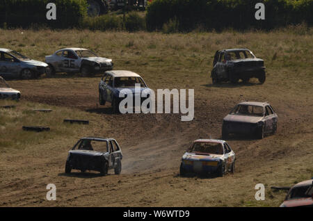 Cars racing at the Golspie Banger Derby 2019, Scottish Highlands Stock Photo