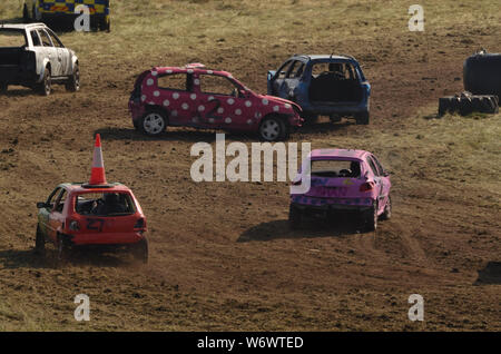 Cars racing at the Golspie Banger Derby 2019, Scottish Highlands Stock Photo