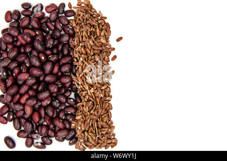 red beans and brown ruby rice on a white background with copy space Stock Photo