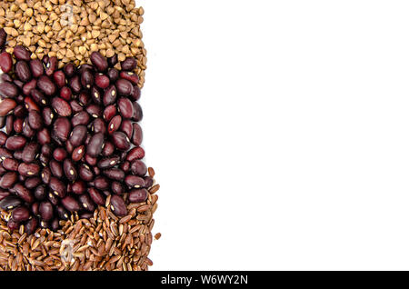 red beans, brown ruby rice and buckwheat on a white background with copy space Stock Photo