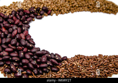 red beans, brown ruby rice and buckwheat on a white background with copy space Stock Photo