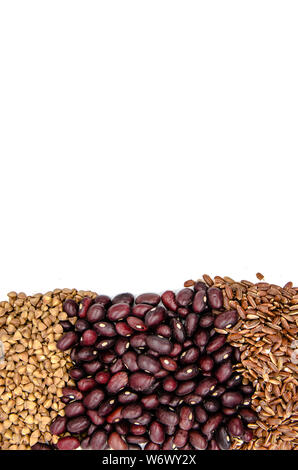 red beans, brown ruby rice and buckwheat on a white background with copy space Stock Photo