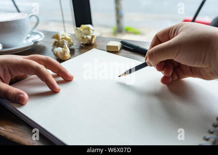 Close up photo of human hand using pencil and drawing  Stock Photo