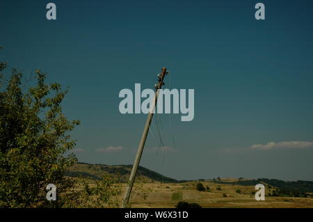 Old pillar with truncate wire in Plana mountain Bulgaria. Stock Photo
