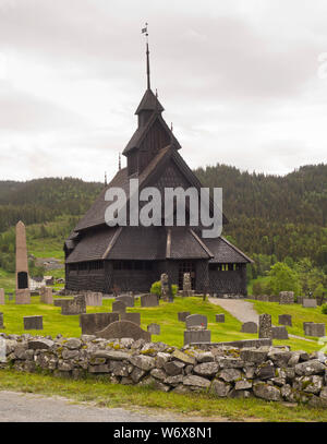 Eidsborg Stave church from the medieval period, a prime example of Norwegian wooden architecture and a tourist attraction surrounded by its cemetery Stock Photo
