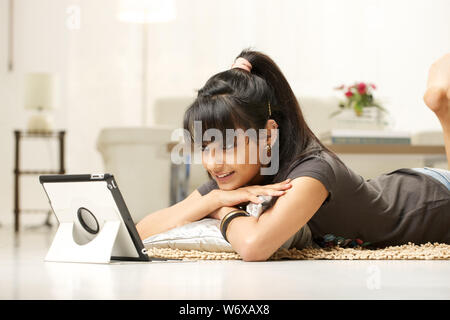 Woman looking at picture frame Stock Photo