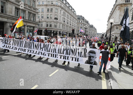 Tommy Robinson supporters in Oxford Street in London protesting against his prison sentence after he was jailed for nine months for contempt of court over a video he broadcast on Facebook which featured defendants in a criminal trial. Stock Photo