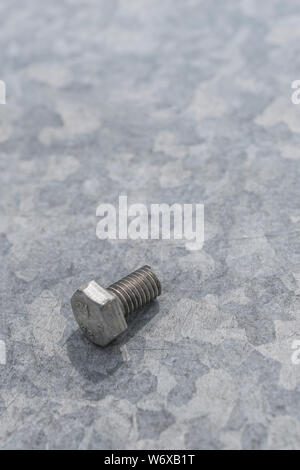 Single isolated galvanized industrial steel screw on white background ...
