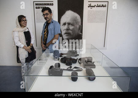 Tehran, Tehran, IRAN. 2nd Aug, 2019. People visit Iranian former AP photographer, Mohammad Sayad's exhibit at the Nabshi Gallery in Tehran, Iran. Credit: Rouzbeh Fouladi/ZUMA Wire/Alamy Live News Stock Photo