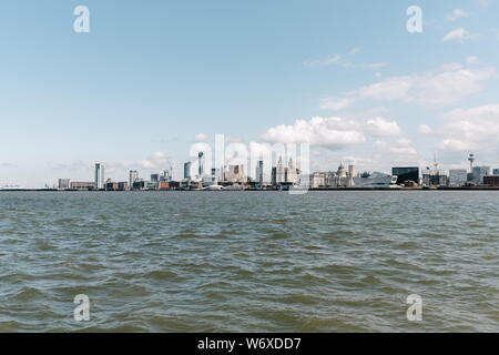 Port of Liverpool and skyline as seen from across the River Mersey in Brikenhead. Stock Photo