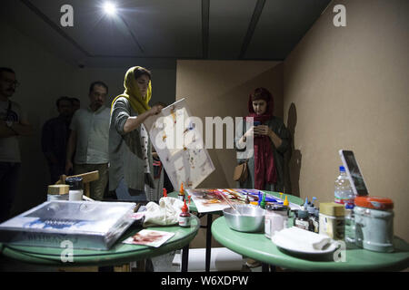 Tehran, Tehran, IRAN. 2nd Aug, 2019. People visit a performance exhibit at the Saless Art Gallery in Tehran, Iran. Credit: Rouzbeh Fouladi/ZUMA Wire/Alamy Live News Stock Photo