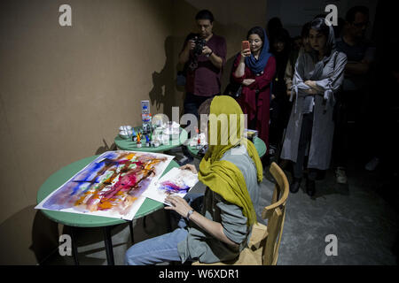 Tehran, Tehran, IRAN. 2nd Aug, 2019. People visit a performance exhibit at the Saless Art Gallery in Tehran, Iran. Credit: Rouzbeh Fouladi/ZUMA Wire/Alamy Live News Stock Photo