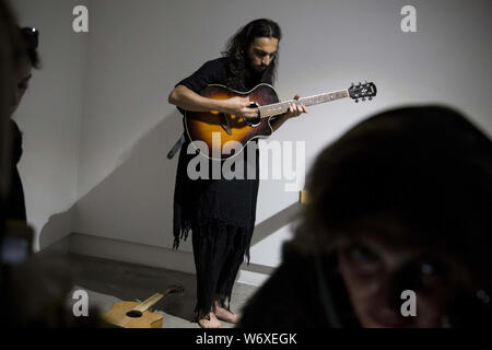 Tehran, Tehran, IRAN. 2nd Aug, 2019. People visit a performance exhibit at the Saless Art Gallery in Tehran, Iran. Credit: Rouzbeh Fouladi/ZUMA Wire/Alamy Live News Stock Photo