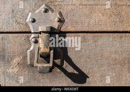 Old weathered retro vintage grunge suitcase metal latch lock closeup Stock Photo