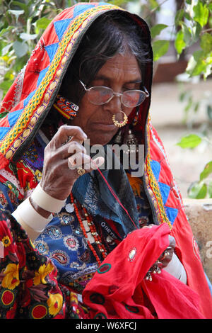 Rajasthani woman doing embroidery, Surajkund Crafts Mela, Surajkund, Faridabad, Haryana, India Stock Photo