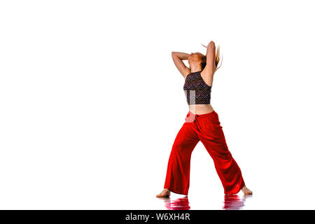 An urban woman is doing breakdance in the studio Stock Photo