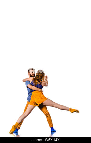 Teenagers skill and talent of modern dance, dancing in studio over white background Stock Photo