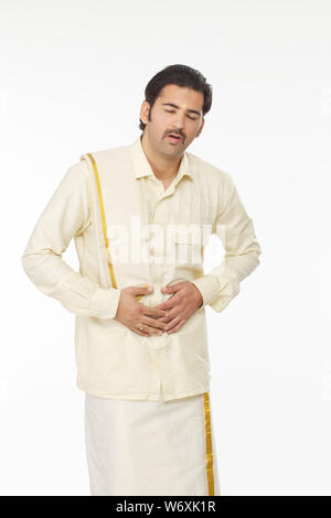 South Indian man suffering from abdominal pain Stock Photo