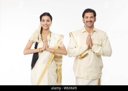 South Indian couple welcoming with hands joined Stock Photo