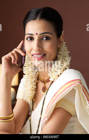 South Indian woman talking on a mobile phone Stock Photo