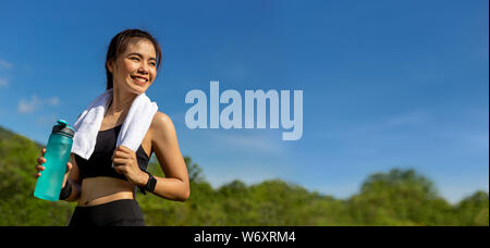 Young Asian Woman With Water Bottle On White Background Stock