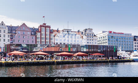 Bergen, Norway, Scandinavia - July 30, 2019: Restaurants along the Port of Bergen with view on the historical buildings of Bryggen in Bergen, Norway Stock Photo