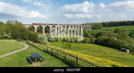 DB cargo class 66 locomotive crossing Cefn Mawr Viaduct (north of Chirk) with a freight train carrying semi finished steel Stock Photo