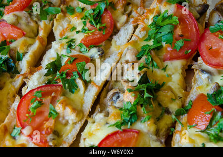 hot baguette with chicken, mushrooms and tomatoes Stock Photo