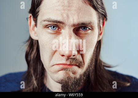 the guy with the long hair and the half-face beard. Stock Photo