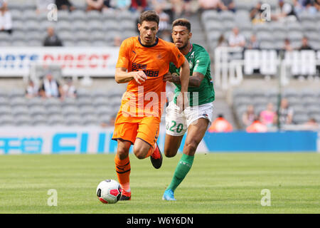 NEWCASTLE UPON TYNE, ENGLAND. 3rd August Newcastle United's Fabian Schar competes for the ball with Saint-Etienne's Denis Bouanga during the Pre-season Friendly match between Newcastle United and AS Saint-Etienne at St. James's Park, Newcastle on Saturday 3rd August 2019. (Credit: Steven Hadlow | MI News) Credit: MI News & Sport /Alamy Live News Stock Photo