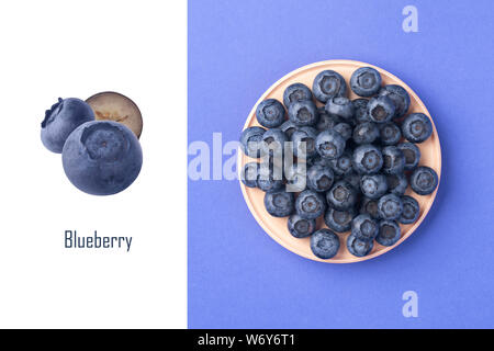Creative layout made of ripe blueberries in the wooden bowl. Top view, summer berries on a blue background Stock Photo