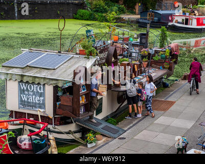 The 'Word On The Water' floating London Book Barge on London's Regents Canal Towpath next to the Granary Square development nr Kings Cross Station. Stock Photo