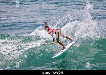 Keala Tomoda-Bannert of Hawaii competes in the Vans US Open of Surfing 2019 Stock Photo