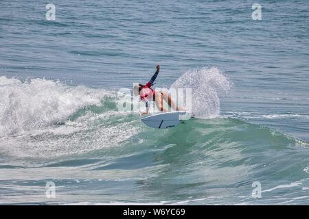 Keala Tomoda-Bannert of Hawaii competes in the Vans US Open of Surfing 2019 Stock Photo