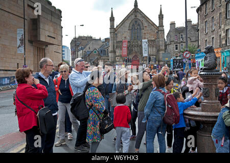 Edinburgh, city centre, Scotland, UK. 3rd August 2019. walking around the city it is evident that there are many more walking tour groups wandering through the capital's streets than there were in 2018. The weakness of the pound is credited for boosting tourists' spending  power. Today there were several groups of various nationalities taking in the sites with a guide led tour. It is reported that summer flight bookings from long-haul markets were  6% higher than in the same period last year. Stock Photo