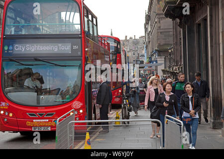 Edinburgh, city centre, Scotland, UK. 3rd August 2019. walking around the city it is evident that there are many more walking tour groups wandering through the capital's streets than there were in 2018. The weakness of the pound is credited for boosting tourists' spending  power. Today there were several groups of various nationalities taking in the sites with a guide led tour. It is reported that summer flight bookings from long-haul markets were  6% higher than in the same period last year. Stock Photo