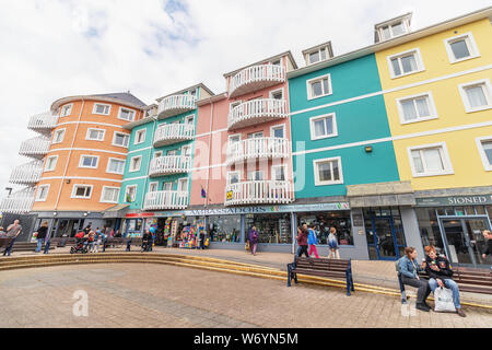 Aberystwyth, Wales / UK - July 20th 2019 -  Colourful houses and shops by the sea front in the seaside town of Aberystwyth Stock Photo