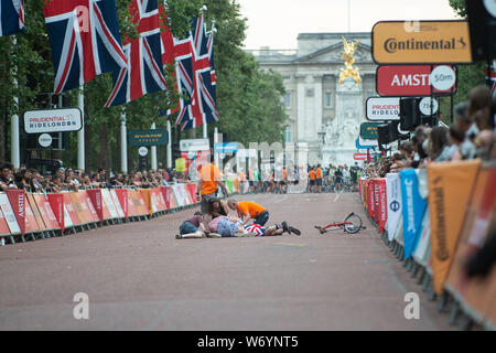 The Mall, London, UK. 3rd August 2019. Accident which involved a rider at Brompton World Championship The 500 riders start the Brompton World Championship with a Le Mans style dash for their folded cycles, having to unfold and set up their bikes before jumping on board and setting off on the 16k circuit around St. James's Park. Credit: Quan Van/Alamy Live News Stock Photo