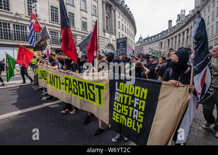 London, UK. 3rd August 2019. London Anti-Fascist Assembly banner at the front of the march in London to stop the racist 'Free Tommy' protesters marching. They say Tommy Robinson, in prison for deliberate contempt of court, is part of a far-right movement spreading violence across the world, whipping up hatred against Muslims and refugees. The Anti-fascists set off up Regent St and the Anti-racists joined behind them. Police stopped them close to Oxford Circus, but they went through side streets to get close to the 'Free Tommy' event before being stopped again. Peter Marshall Alamy Live News Stock Photo