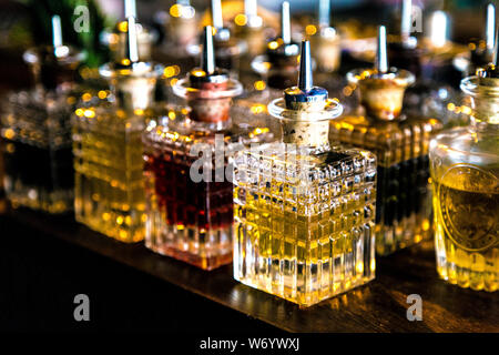 Liquor bottles on the bar counter of Viktor Wynd Museum of Curiosities and Last Tuesday Society, London, UK Stock Photo