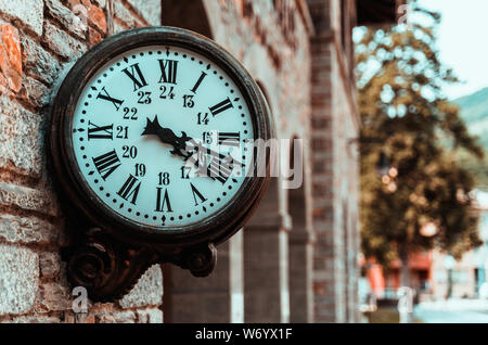 Old retro wall clock at a train station Stock Photo