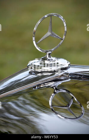 vintage mercedes classic car radiator emblem and reflection Stock Photo