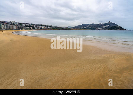 La Concha beach a low tide winter day, San Sebastian, Basque Country, Spain Stock Photo