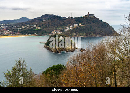 Winter landscape of La Concha bay in San Sebastian with Santa Clara Island and Monte Igueldo, Basque Country, Spain Stock Photo