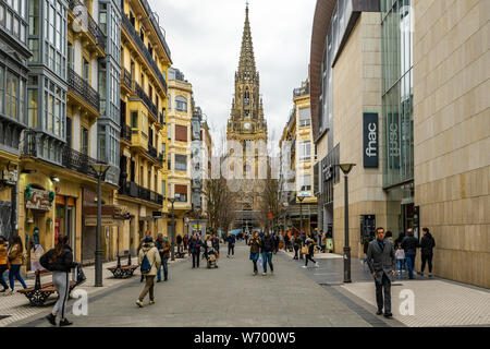 A street in San Sebastian downtown leading to Buen Pastor Cathedral. San Sebastian, Basque Country, Spain, January 2019 Stock Photo