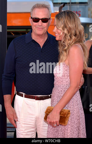 HOLLYWOOD, CA - AUGUST 01: Kevin Costner, Christine Baumgartner arrives for the Premiere Of 20th Century Fox's 'The Art Of Racing In The Rain' held at Stock Photo