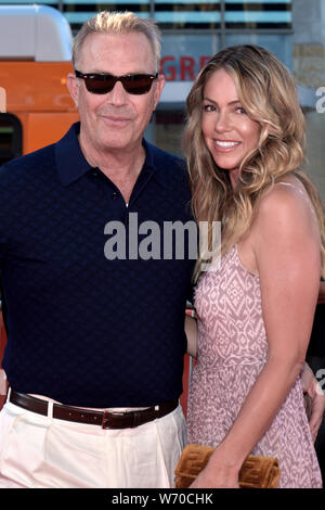 HOLLYWOOD, CA - AUGUST 01: Kevin Costner, Christine Baumgartner arrives for the Premiere Of 20th Century Fox's 'The Art Of Racing In The Rain' held at Stock Photo